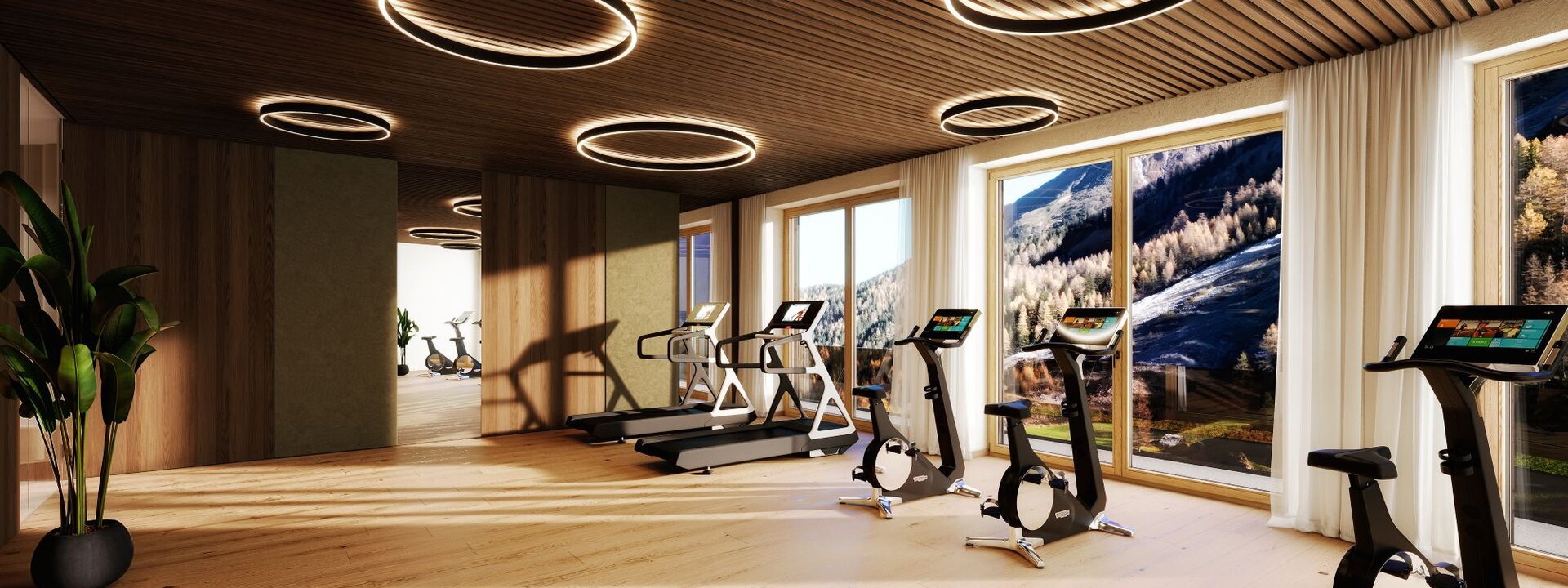 Ein schöner Interior Fitnessraum mit mehreren Geräten.