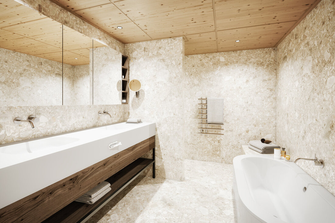 Ein modernes Badezimmer mit einer eleganten Badewanne und einem großen Waschbecken aus weißem Material, umgeben von Naturstein.
