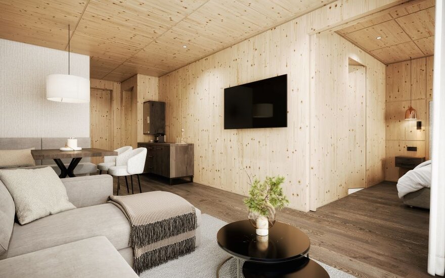 Ein modernes Interieur mit Holzverkleidung, einem gemütlichen Sofa und einem eleganten Tisch in einem hellen Raum.