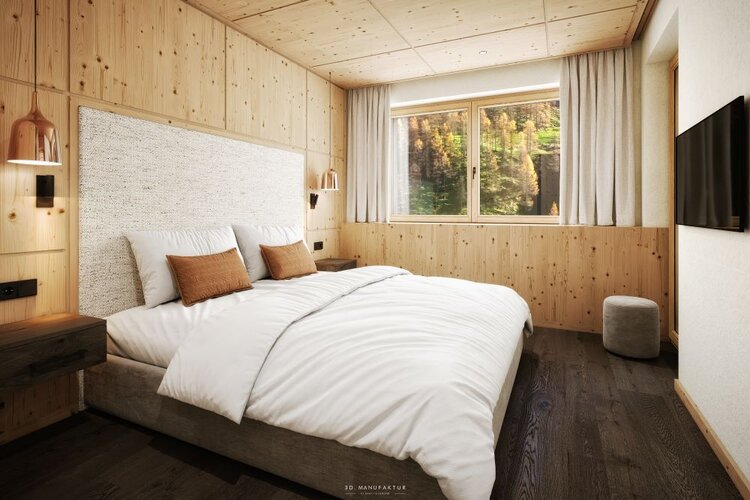 Ein gemütliches Schlafzimmer mit einem großen Bett, Holzverkleidung und einem Fenster, das auf eine grüne Landschaft blickt.